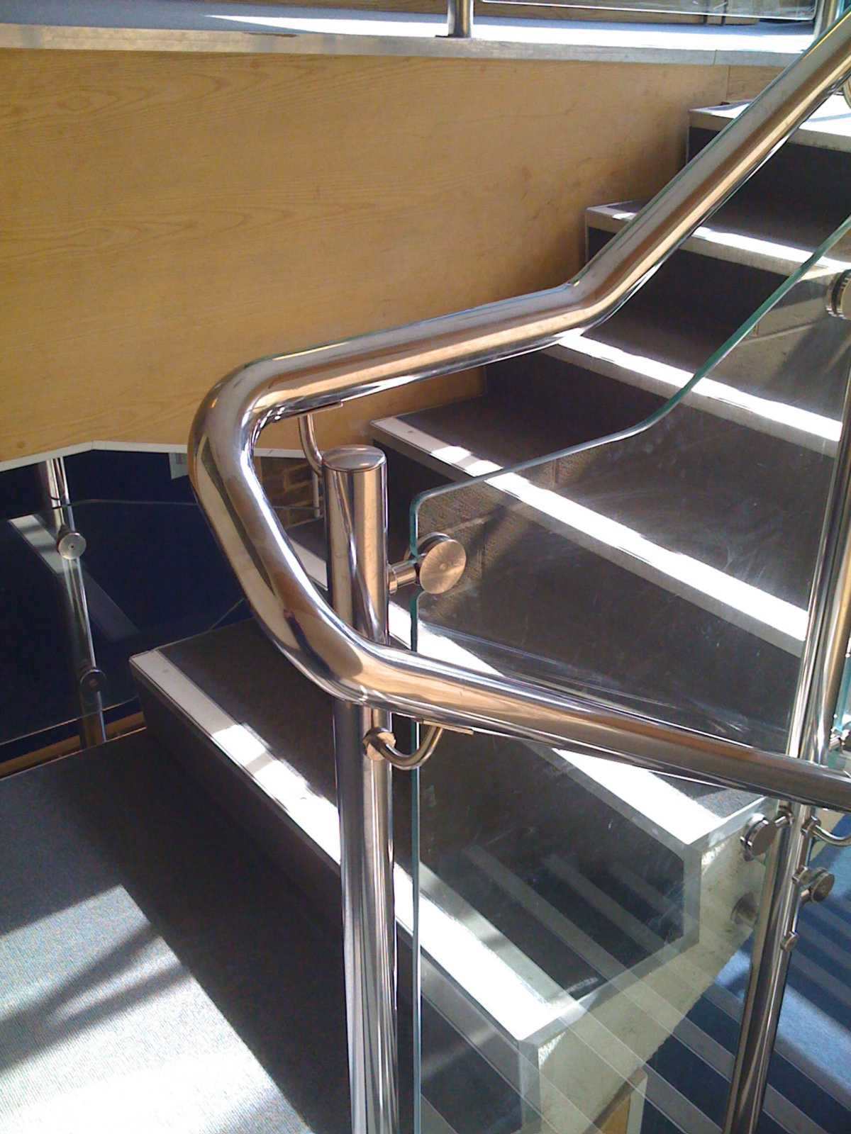 rounded corner of stainless steel staircase handrail