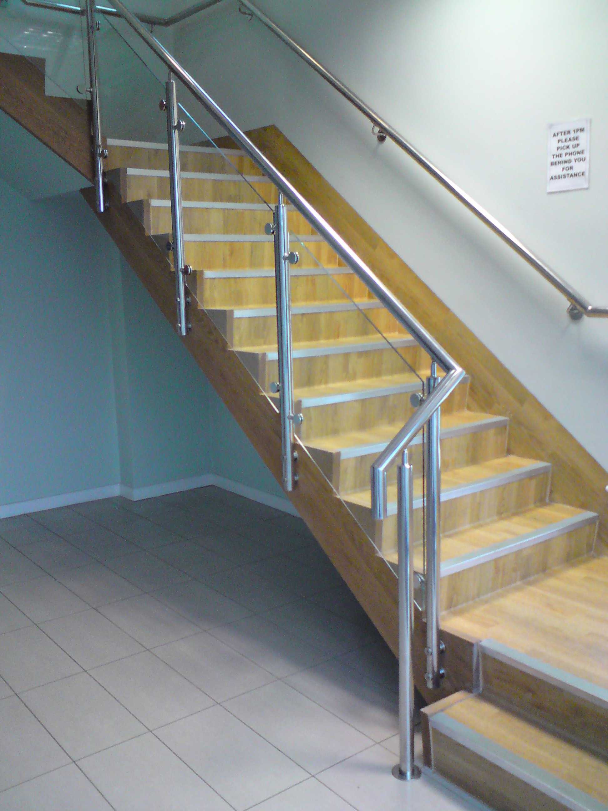 staircase with glass infill and stainless steel handrail