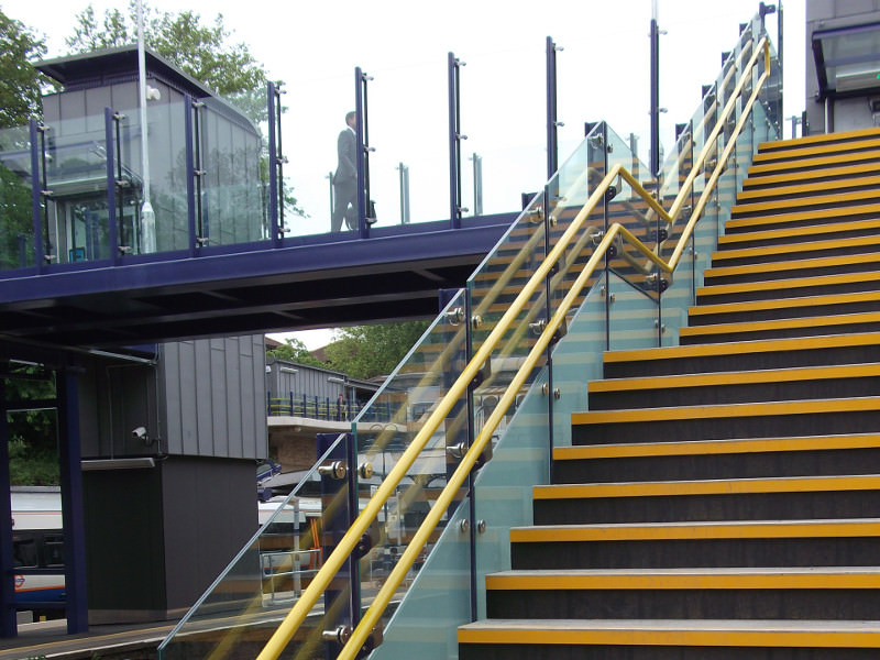 Handrail and balustrade for railway footbridge