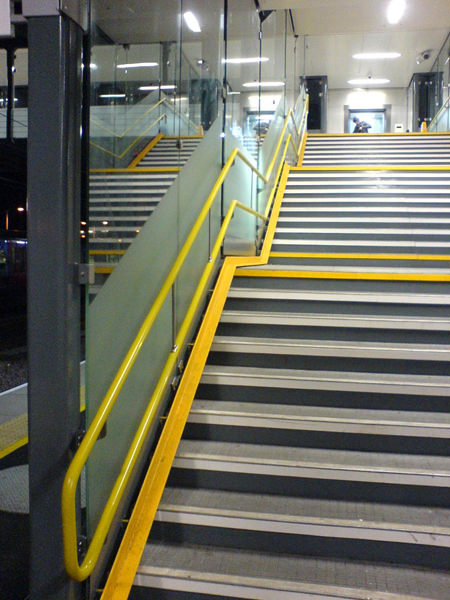 Railway Station staircase with yellow Handrail