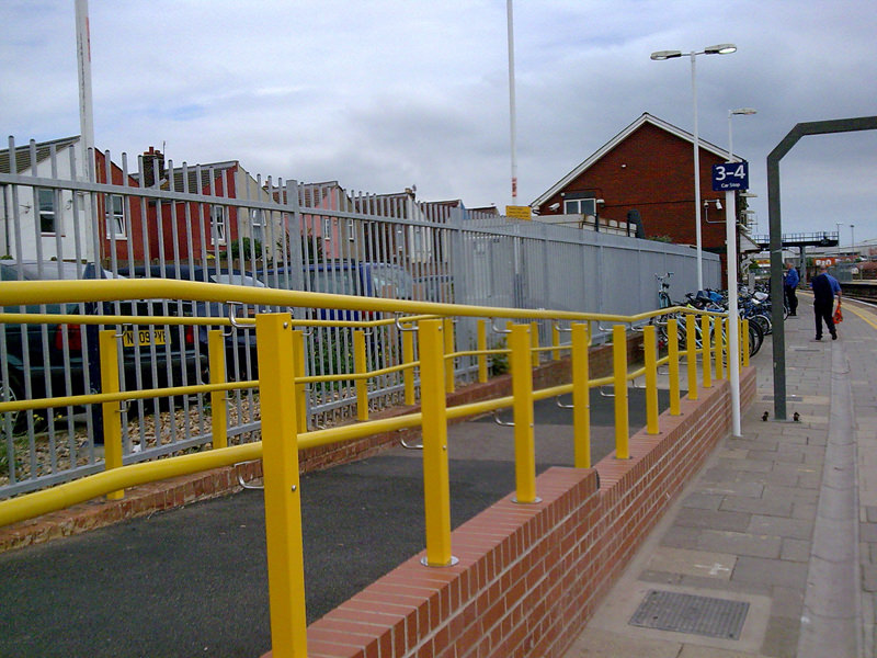 Yellow external handrail at railway
