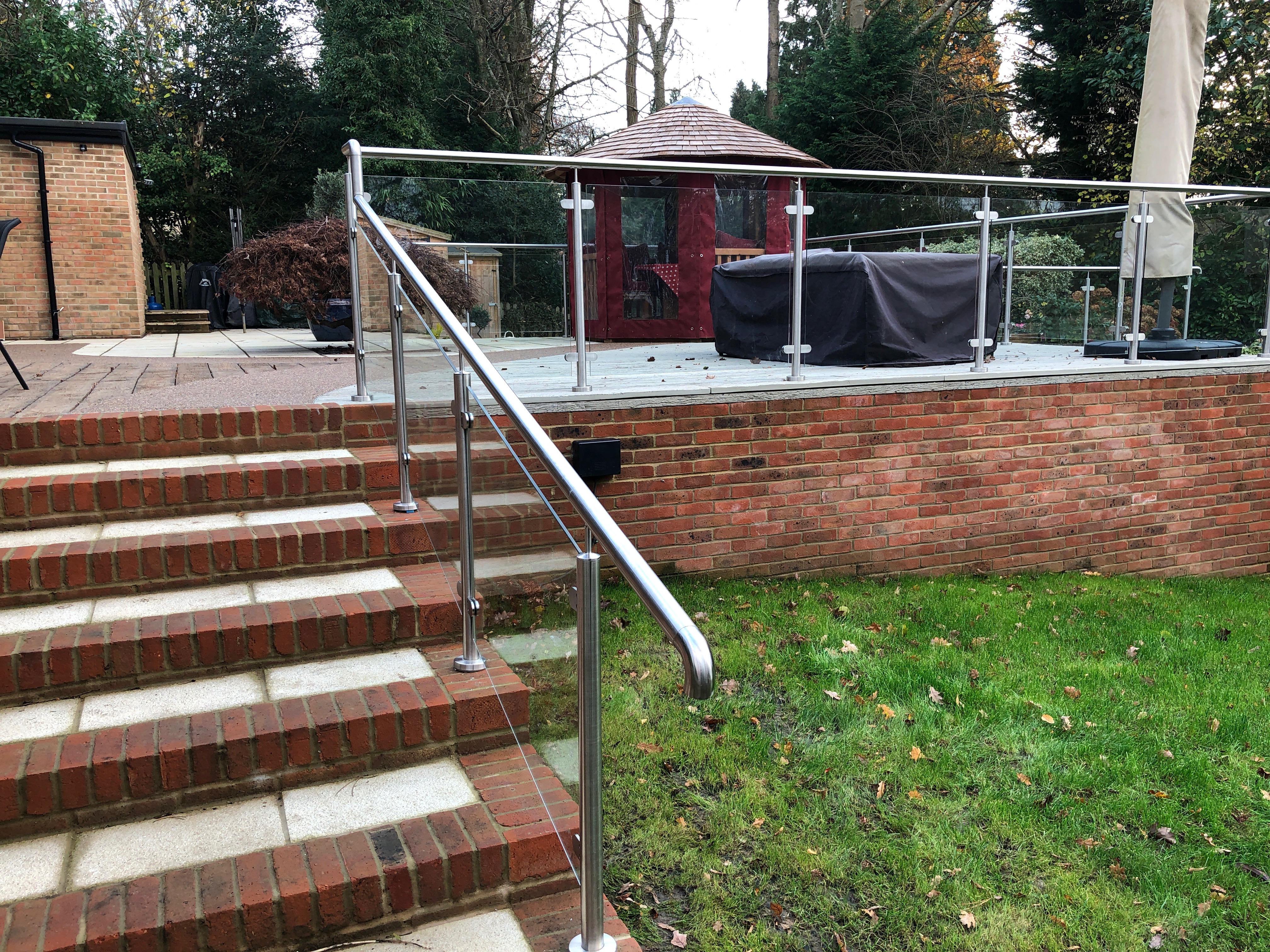 Glass balustrade on raised patio