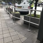 Stainless steel handrail outside of shops