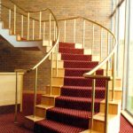 Prestigious staircase with brass handrail