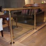 Brass handrail with glass balustrade