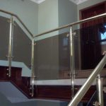 Brass handrail with glass infill