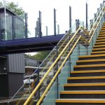 Handrail and balustrade for railway footbridge