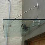 Glass suspended door canopy