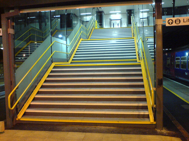 Railway Station staircase with yellow Handrail