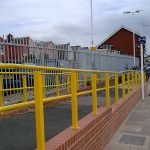 Yellow external handrail at railway