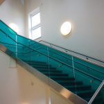 Coloured glass balustrade on staircase