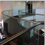 Curved handrail with glass balustrade